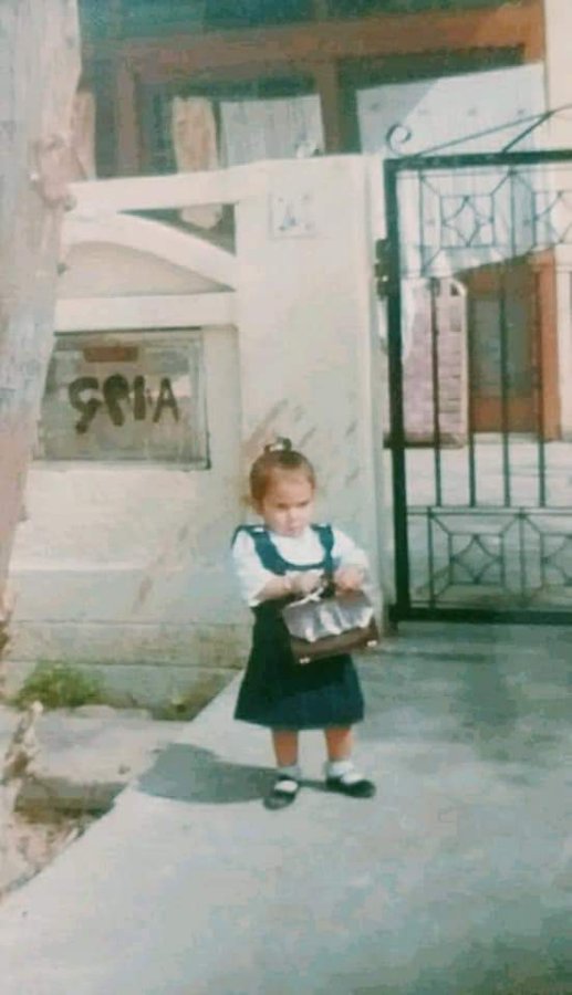 Young Mehak with a bag on her shoulder, mid "shopping trip"